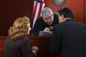 prosecution and attorney at plea bargaining before teh judge